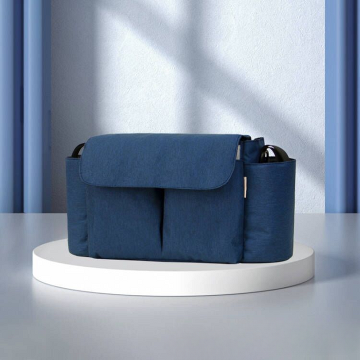 Dark blue stroller organizer with a front flap and side bottle holders