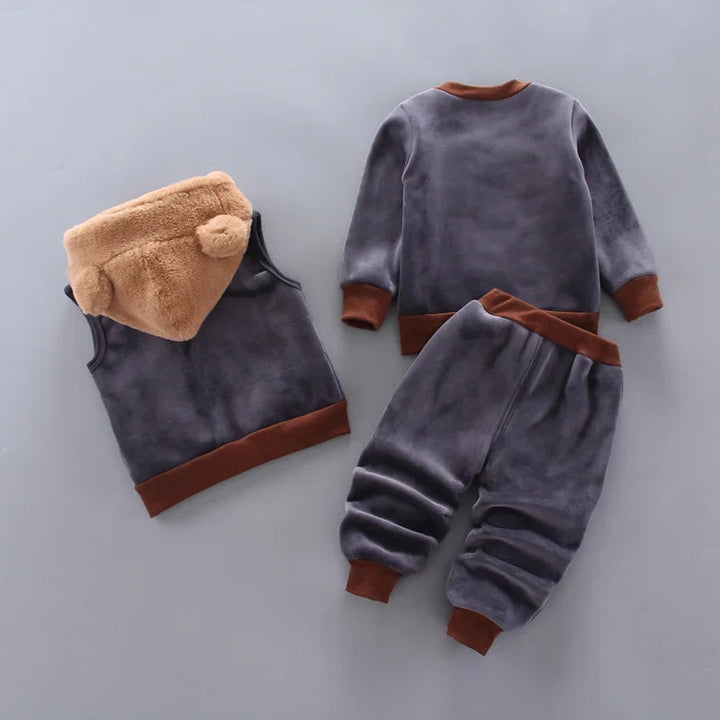 Dark gray outfit shown from the back with a tan hooded vest, pullover top, and matching pants