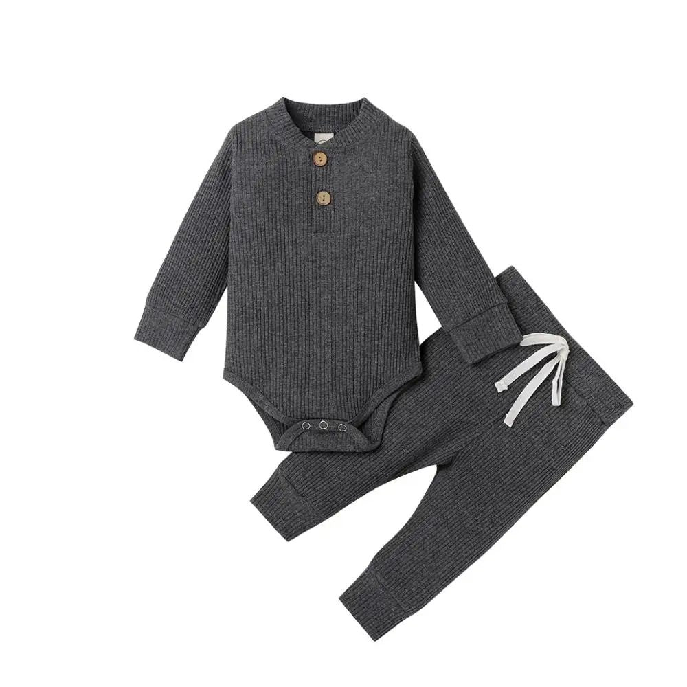Dark gray ribbed baby bodysuit and matching pants with a white waist tie