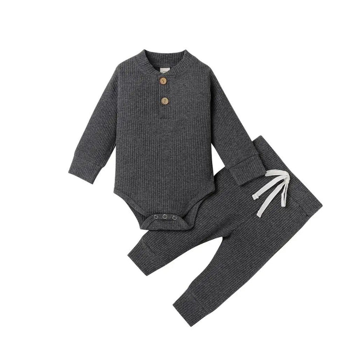 Dark gray ribbed baby bodysuit and matching pants with a white waist tie
