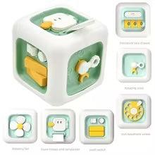 Dark green activity cube with a flower spinner, turning key, number rollers, and yellow panel