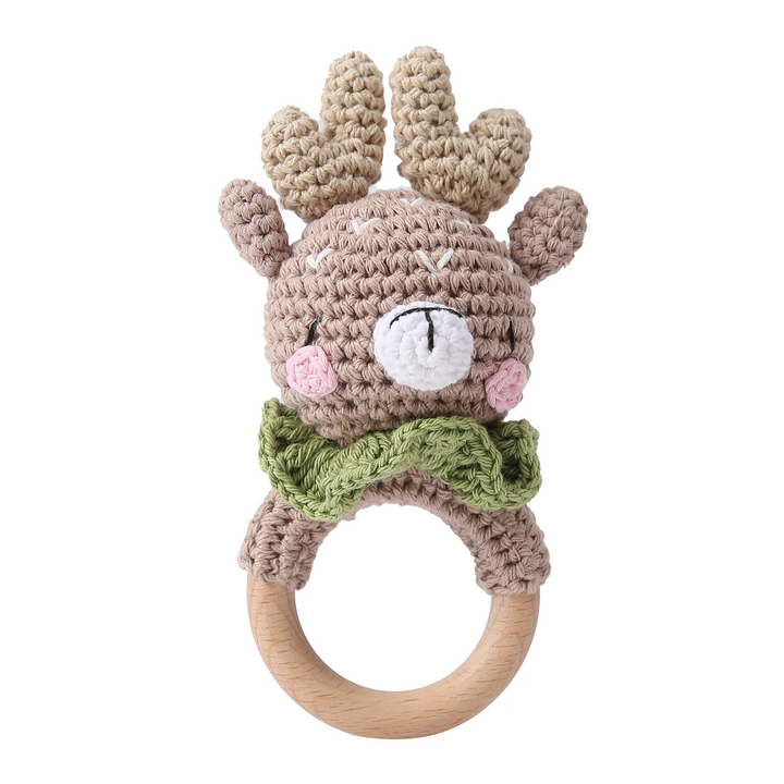Crocheted deer rattle with antlers, pink cheeks, a green collar, and a wooden ring