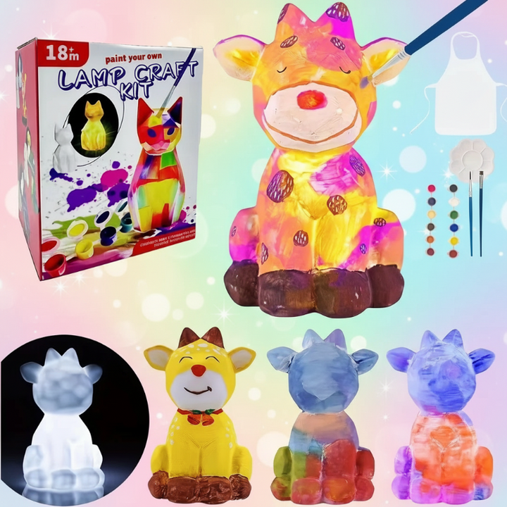 Yellow deer lamp with pink details, painting supplies, and examples of other color combinations.