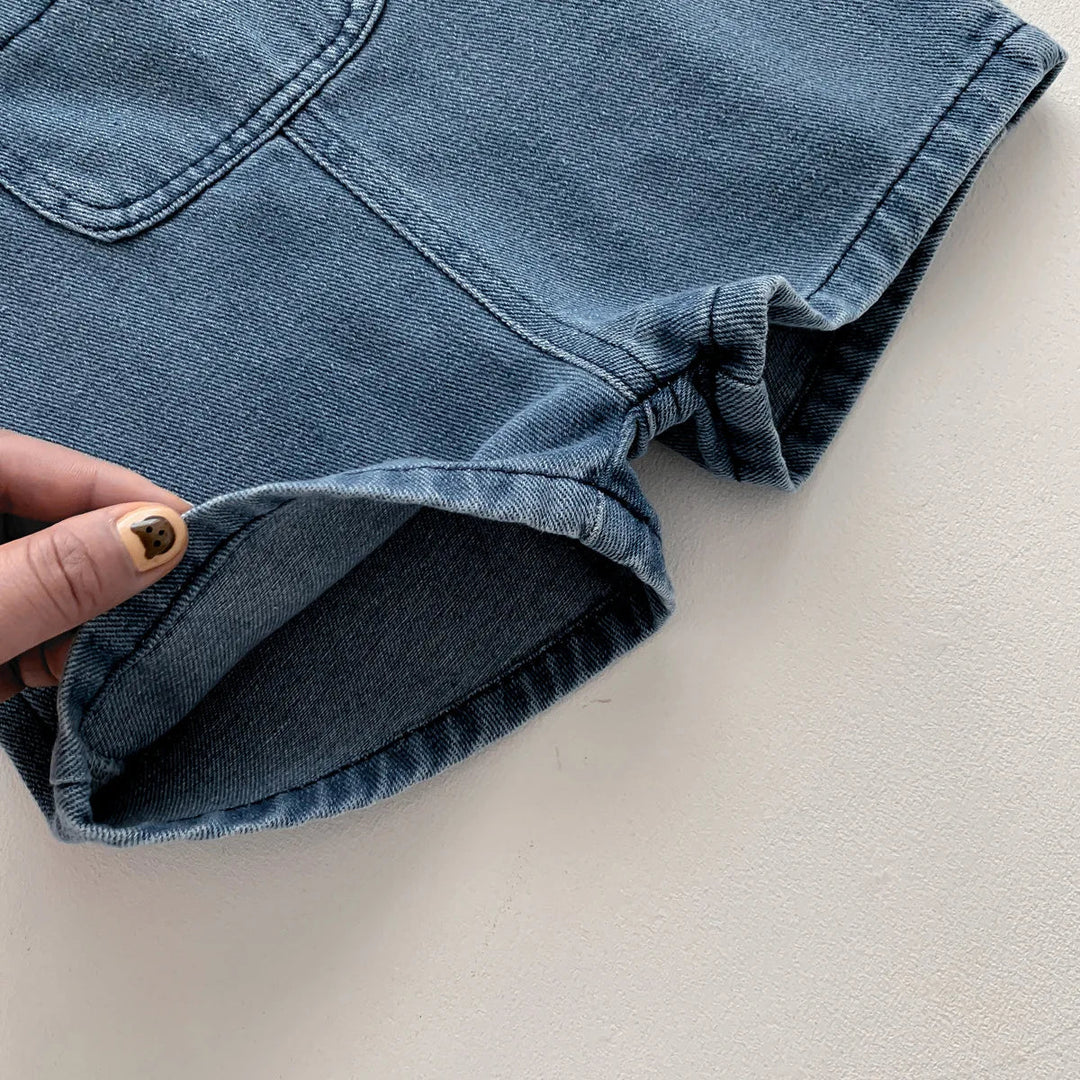 Close-up of the denim short overalls&