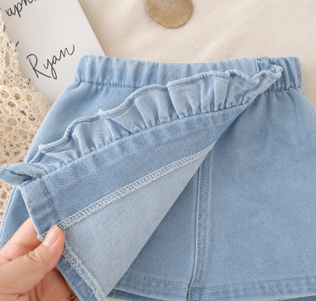 Lifted denim front panel showing the shorts layer beneath the skirt