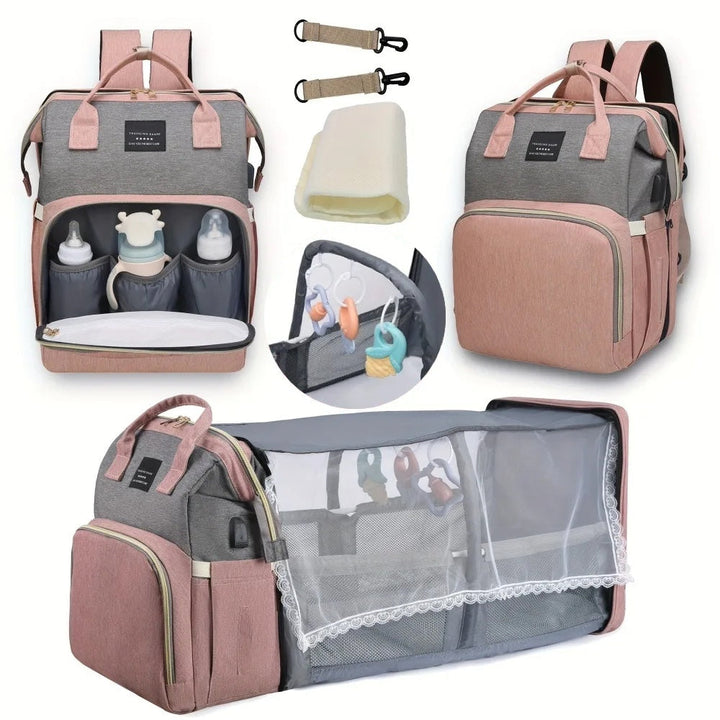 Diaper bag shown open and expanded, with a mattress, stroller clips, and mosquito net.