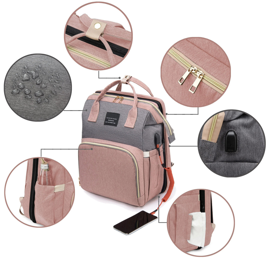 Diaper bag details showing water droplets on fabric, zippers, side pockets, handles, and a USB port.
