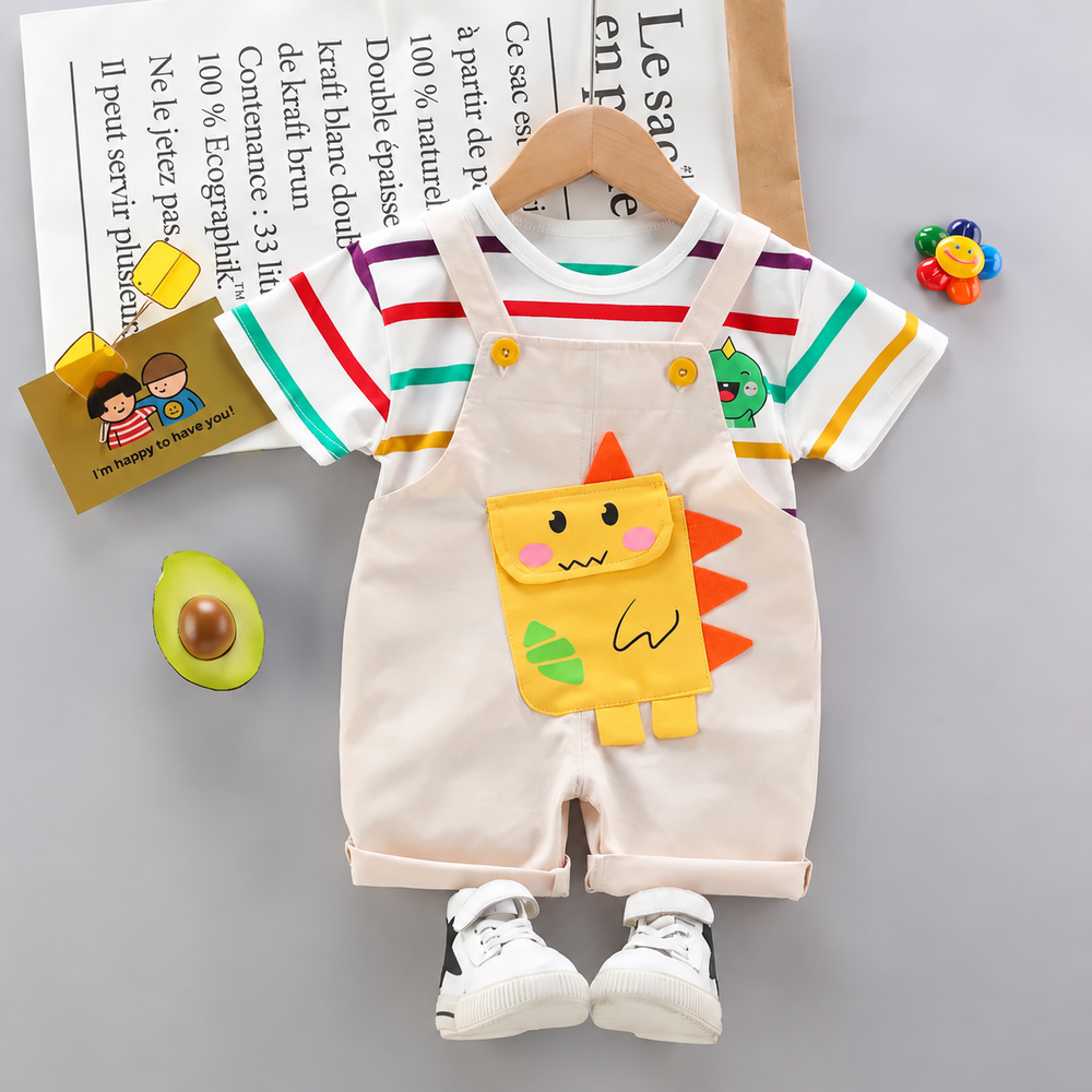 Beige dinosaur short overalls paired with a multicolored striped T-shirt