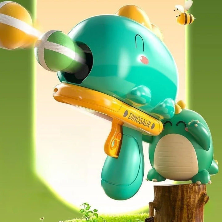 Green dinosaur ball launcher with colorful striped balls in flight