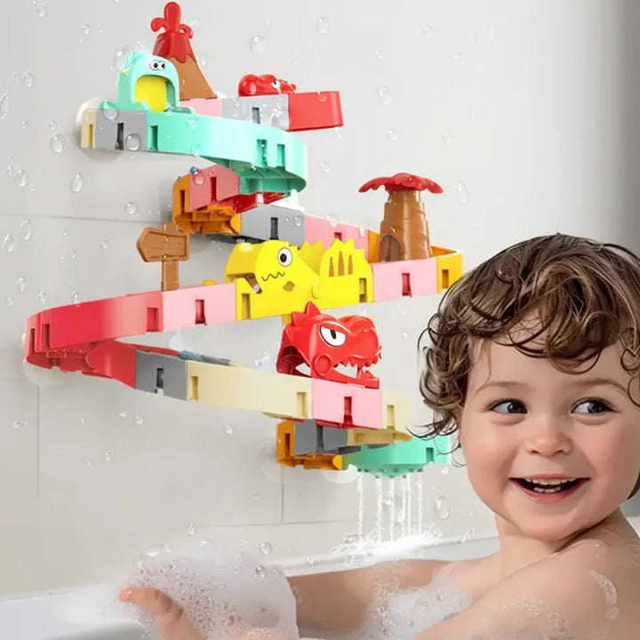 Child in the bath beside a wall-mounted dinosaur water track