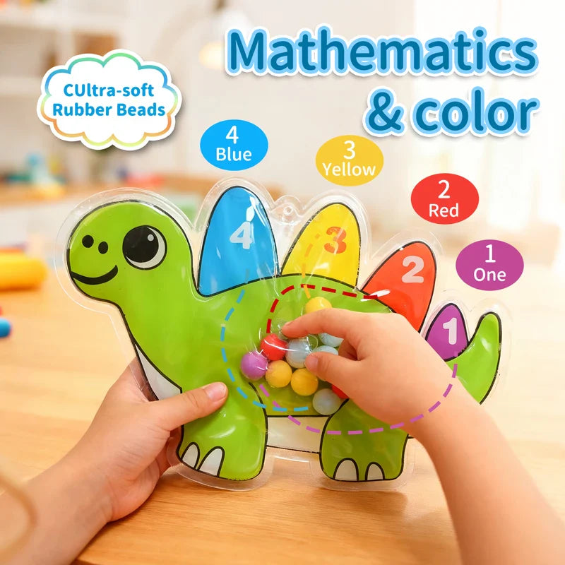Hands guiding beads in a dinosaur maze with numbered, color-coded sections