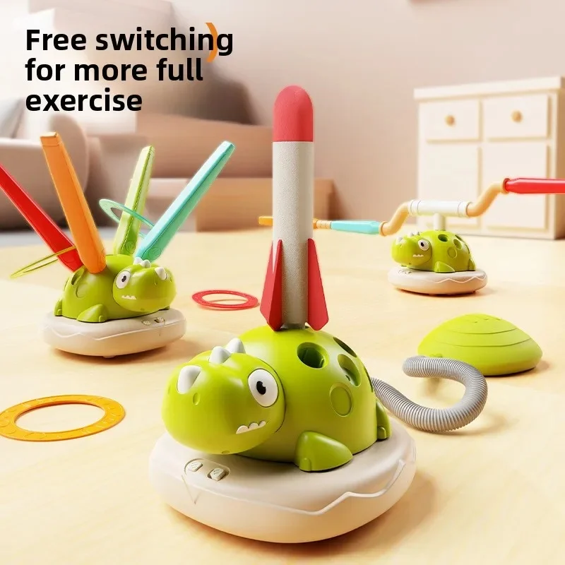 Green dinosaur activity bases arranged for ring toss, rocket launching, and jumping