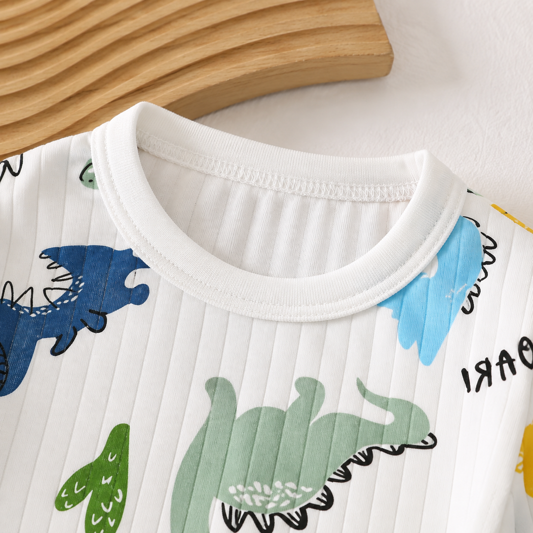 Round neckline and ribbed cotton on the white dinosaur-print pajama top