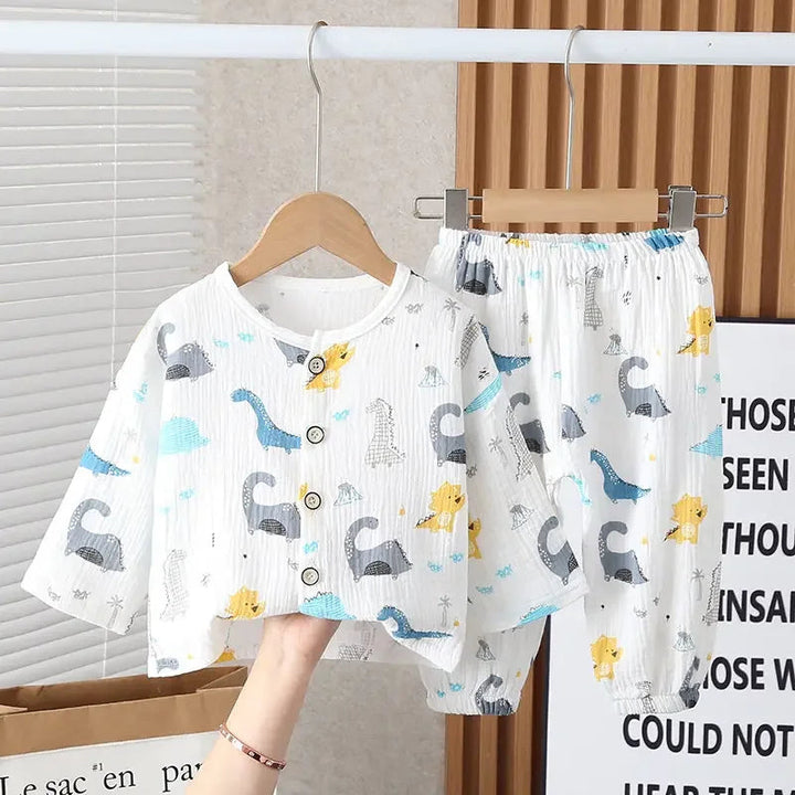 White two-piece pajama set with multicolored dinosaurs and an elastic waistband