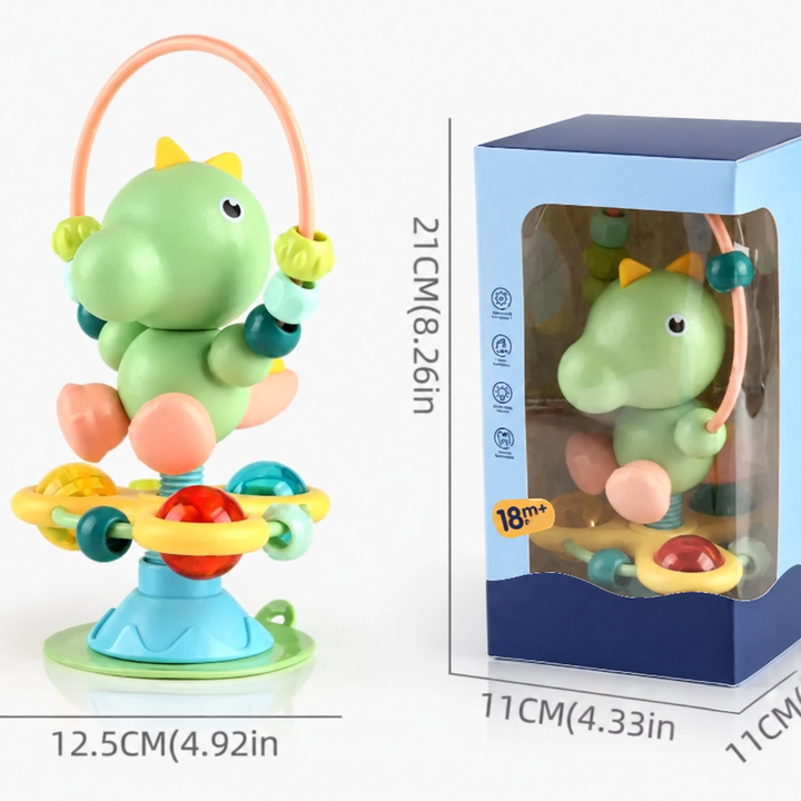 Green dinosaur suction cup rattle shown with measurement guides and its retail box
