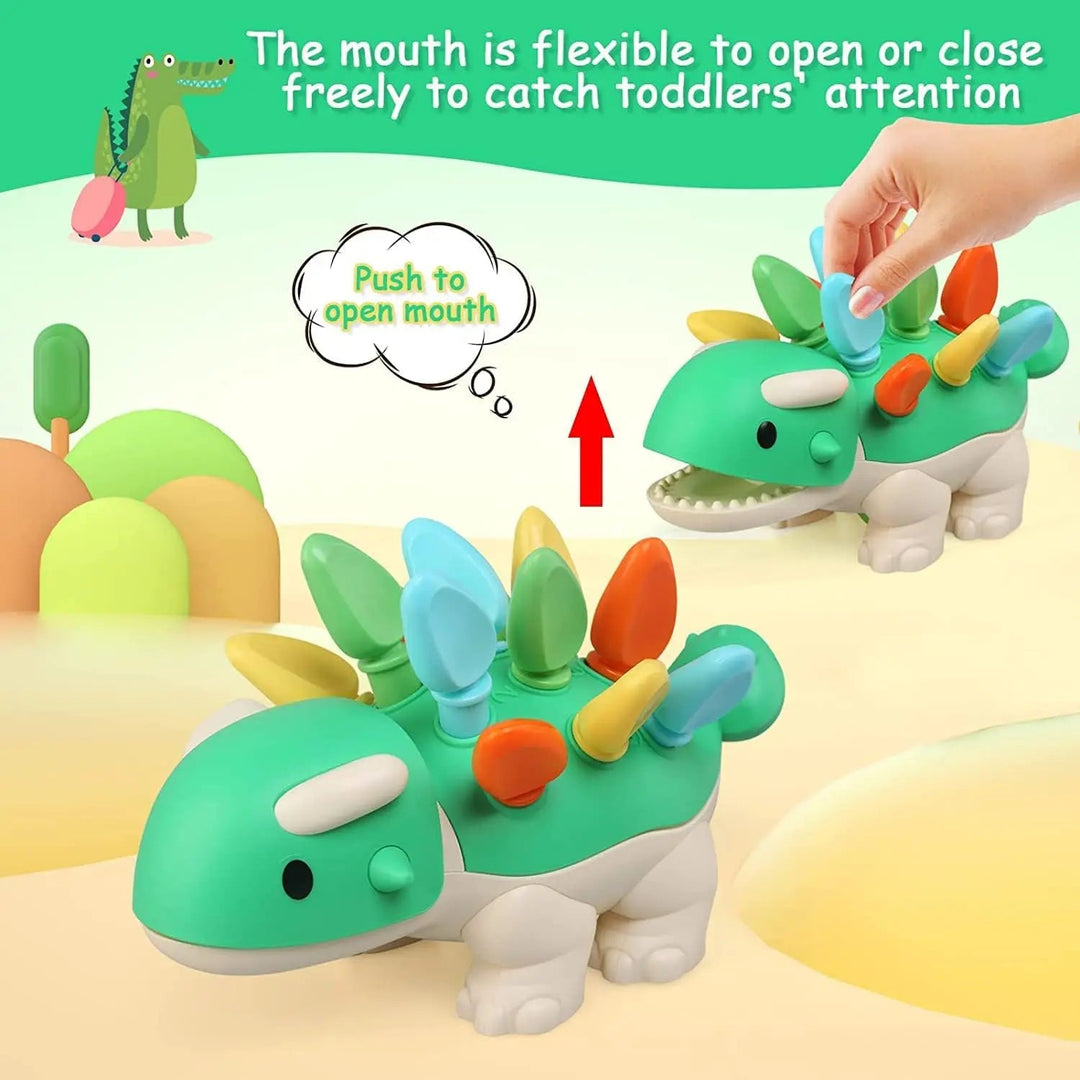 Hand pressing a spike to open the green dinosaur toy&