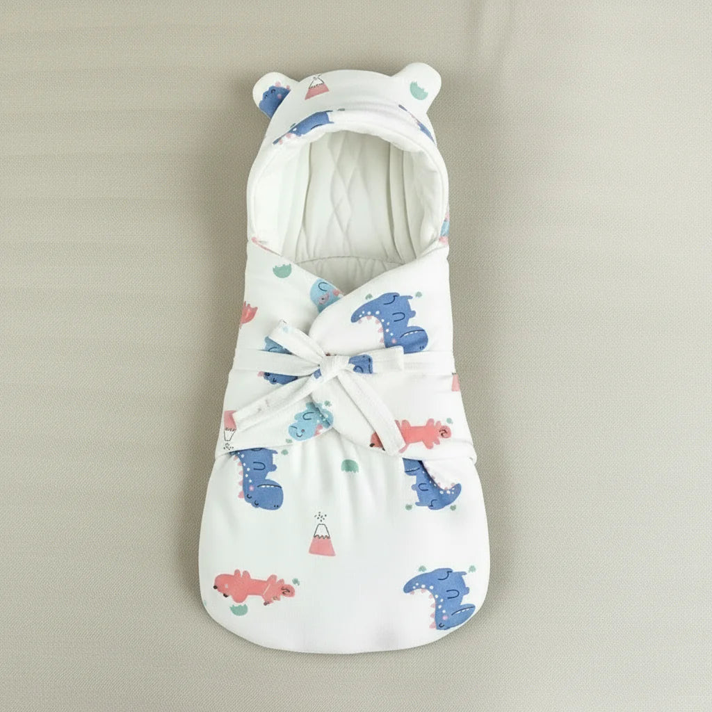 Dinosaur-print baby swaddle blanket laid flat with its front tied closed