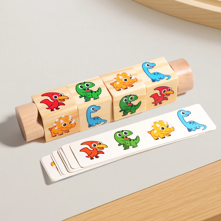 Dinosaur-themed puzzle with four rotating picture cubes and a stack of matching cards