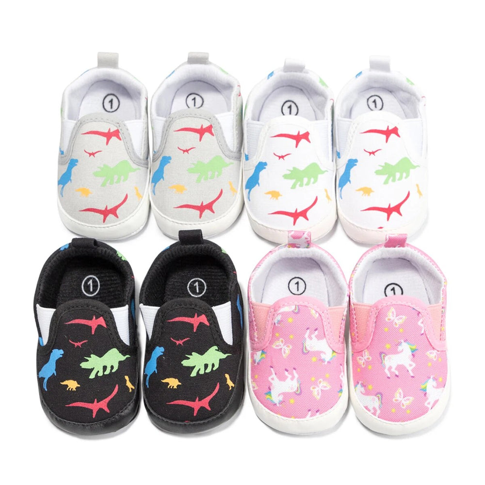 Baby sneaker color options with dinosaur prints in gray, white, and black, plus pink unicorn prints