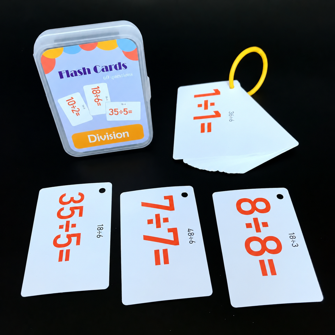 Division flash cards with orange equations, a yellow ring, and a storage case.