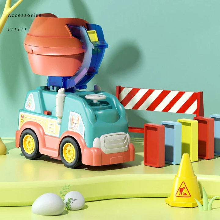Front view of the domino toy truck beside upright pieces, a striped barrier, and a yellow cone