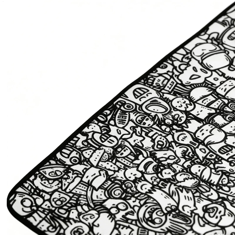 Close-up of detailed black-and-white doodles and the mat&