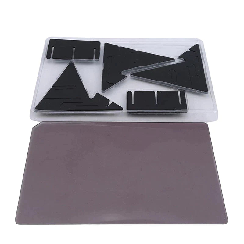 Black stand pieces in a tray beside a separate rectangular tracing panel