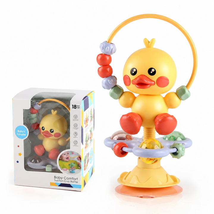 Yellow duck rattle with a bead loop, ball details, and a suction cup base beside its box