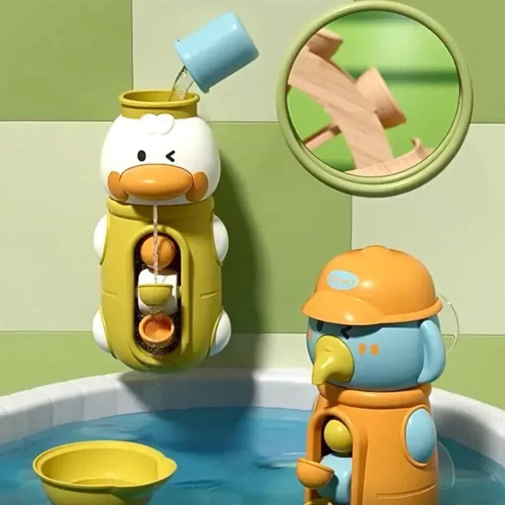 Yellow duck bath spinner being filled with water beside an orange elephant spinner