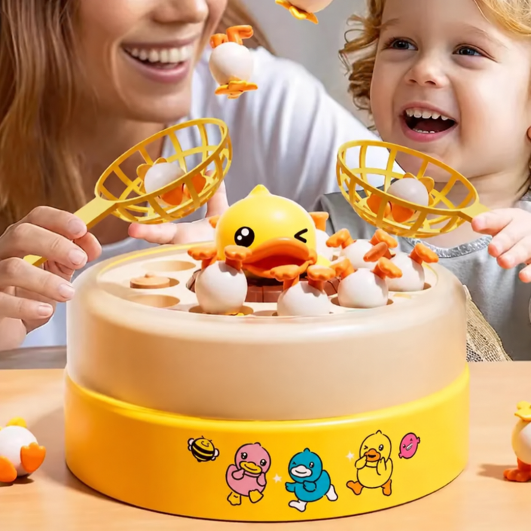 Adult and child playing a yellow duck-catching game with handheld nets