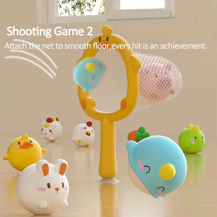 Yellow duck-shaped net used as a target with colorful animal toys nearby