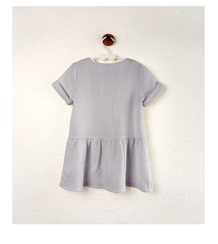Back view of the Dusty Purple dress showing its short sleeves and gathered skirt.