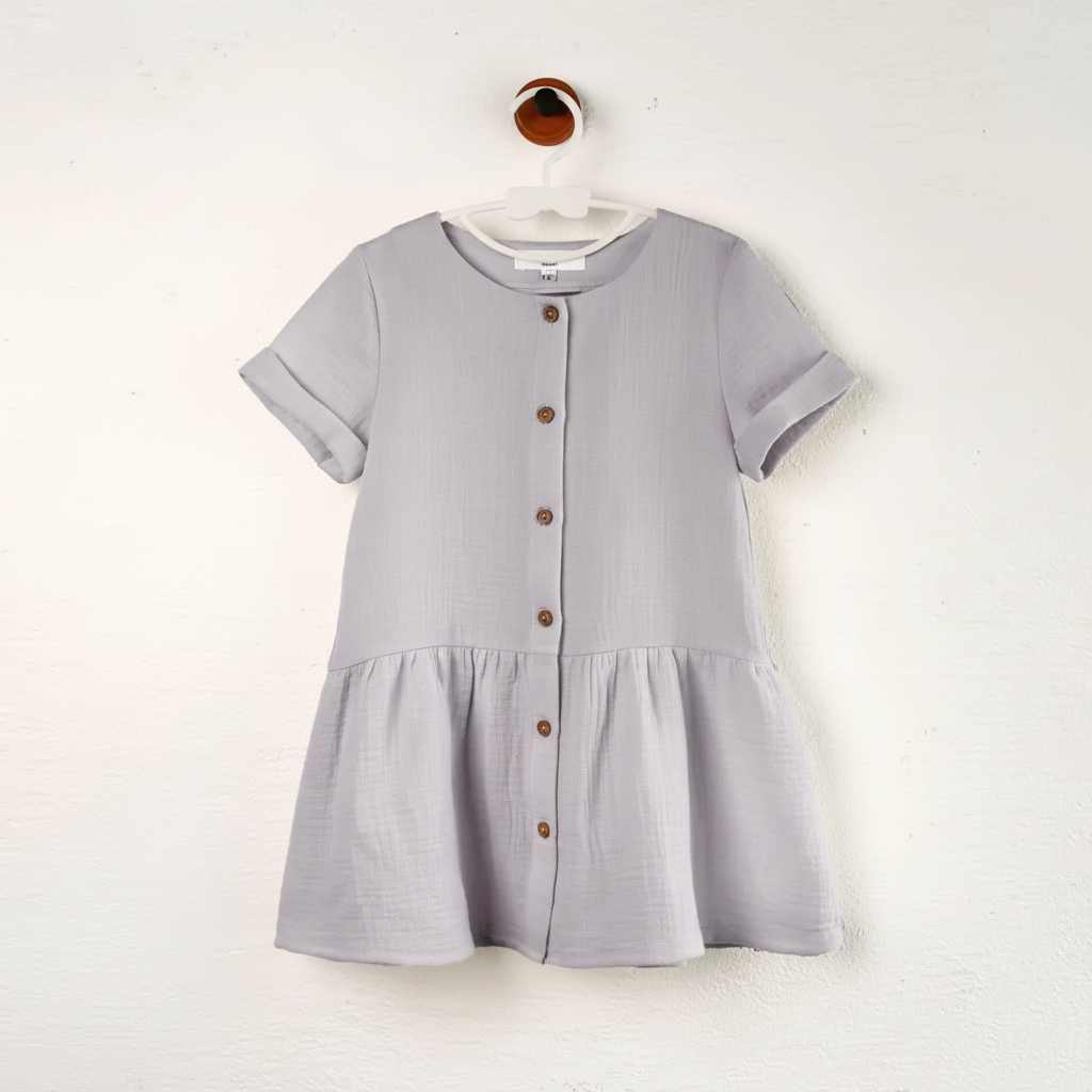 Dusty Purple cotton dress on a hanger with a round neckline and button-front gathered skirt.