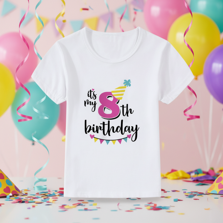 White eighth-birthday T-shirt with a pink number 8, yellow party hat, and colorful bunting