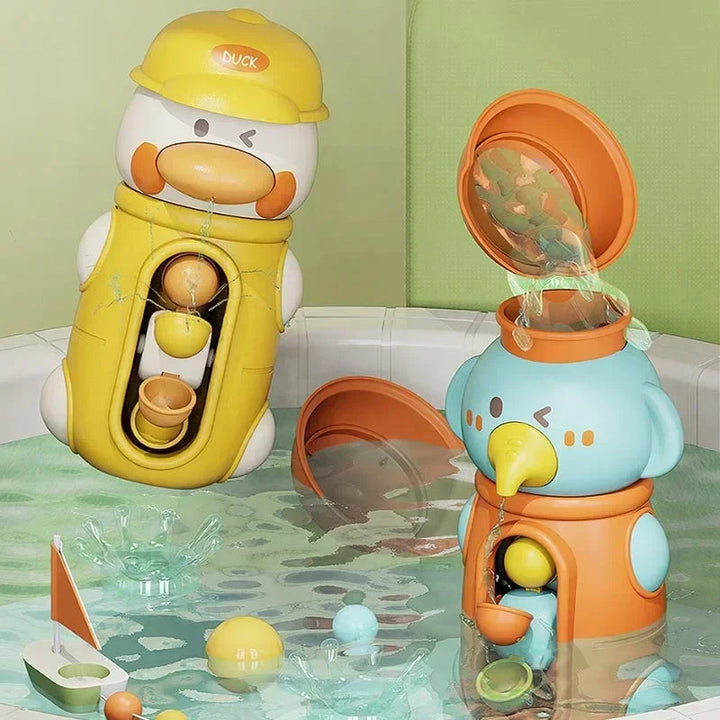 Duck and elephant bath toys beside the tub as water is poured into the elephant&