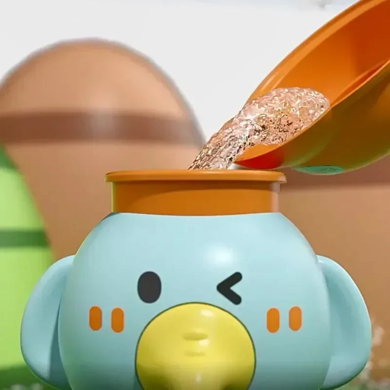 Close-up of water pouring into the open top of the elephant bath toy