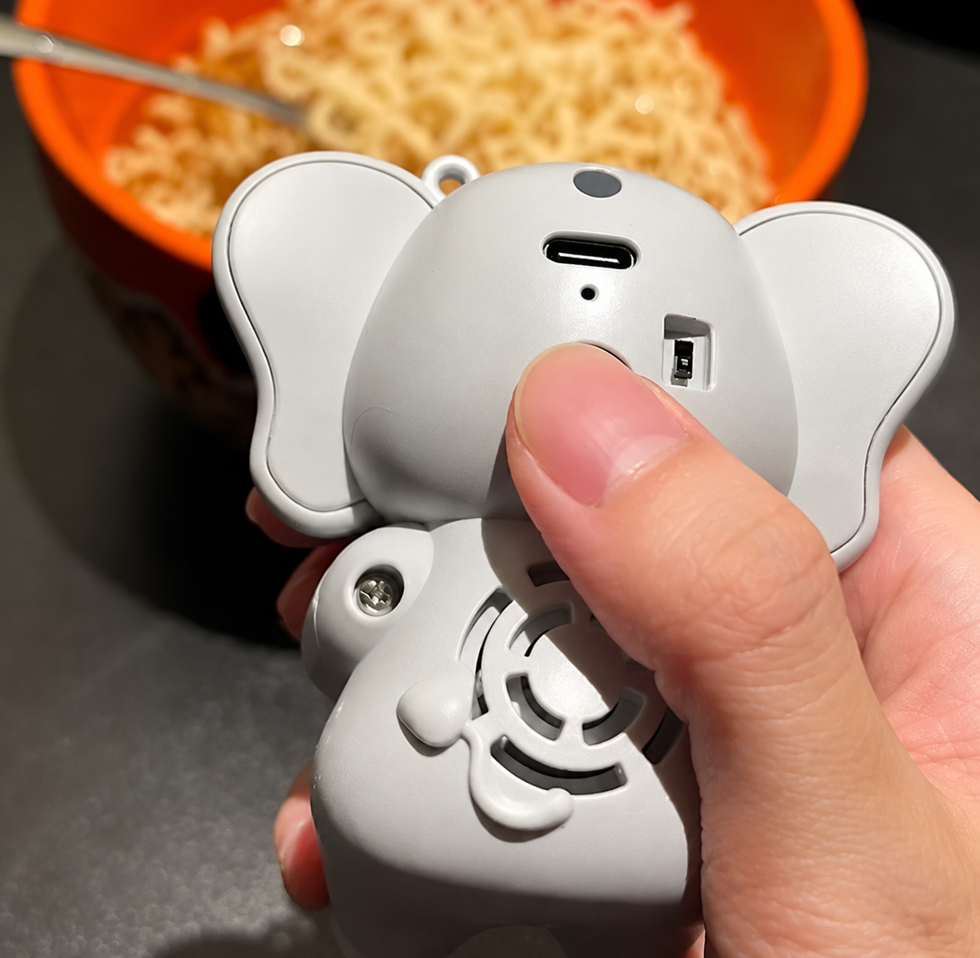 Rear view of the elephant food cooling fan showing its charging port, switch, and air intake
