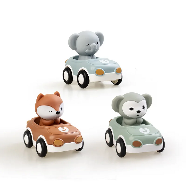 Elephant, fox and monkey figures seated in three colorful toy cars