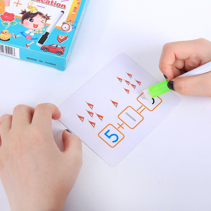 A hand wiping an answer from a reusable addition card
