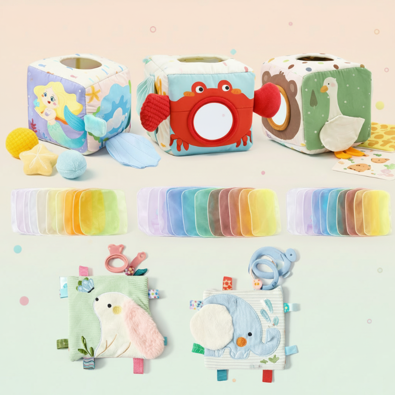 Fabric sensory cubes, colorful scarves, and two touch-and-feel books with teething rings