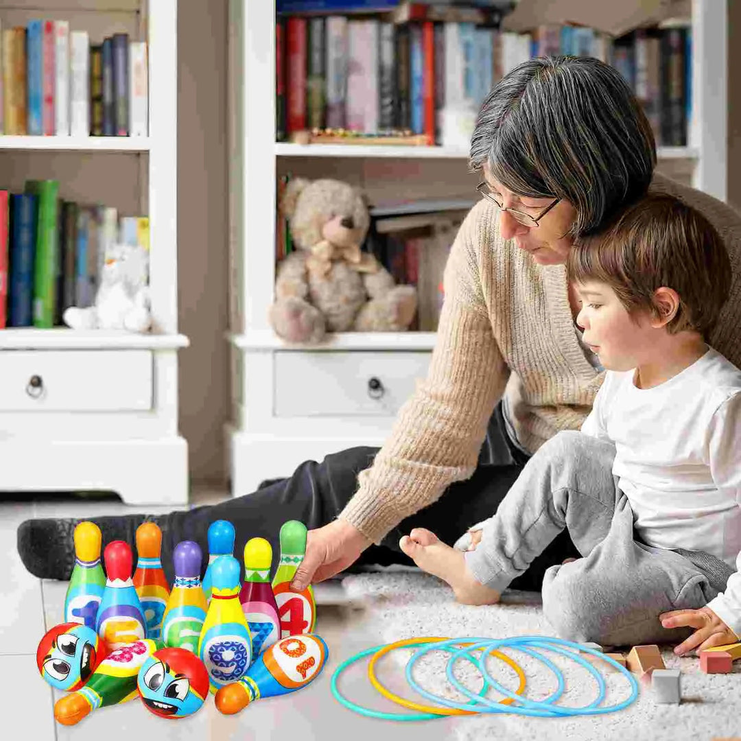 Adult and child setting up colorful bowling pins, balls, and rings on a carpet