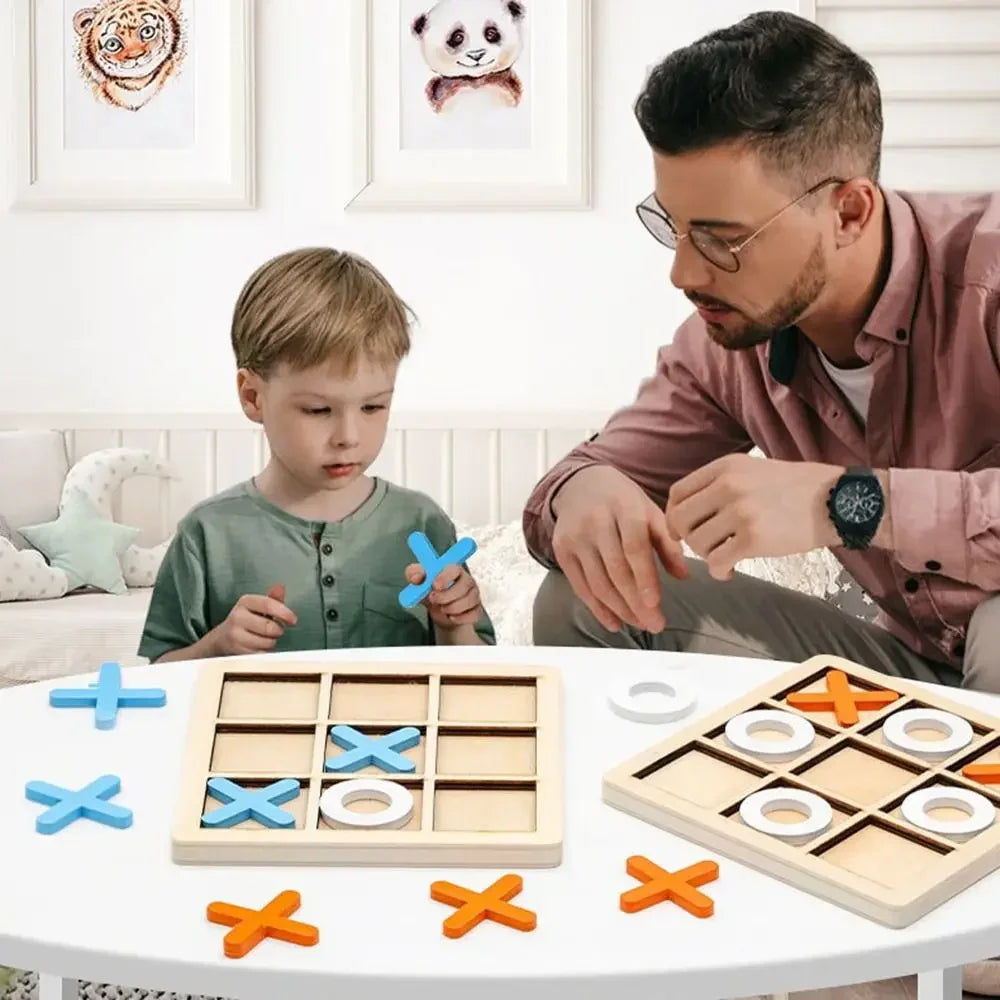 Adult and child playing with wooden tic-tac-toe boards and blue, orange, and white pieces