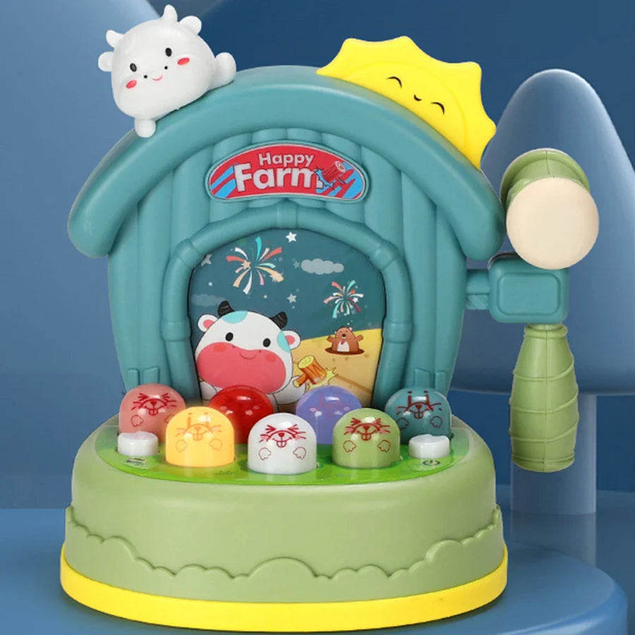 Farm-themed musical tapping toy with colorful targets, a cow decoration, and a side-mounted mallet