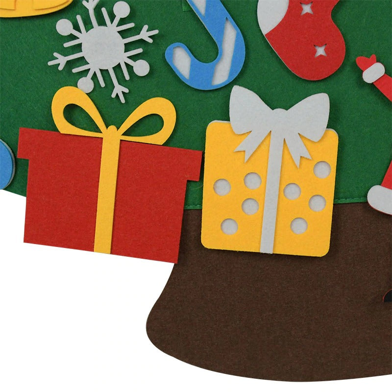 Red and yellow felt gift decorations beside the tree&