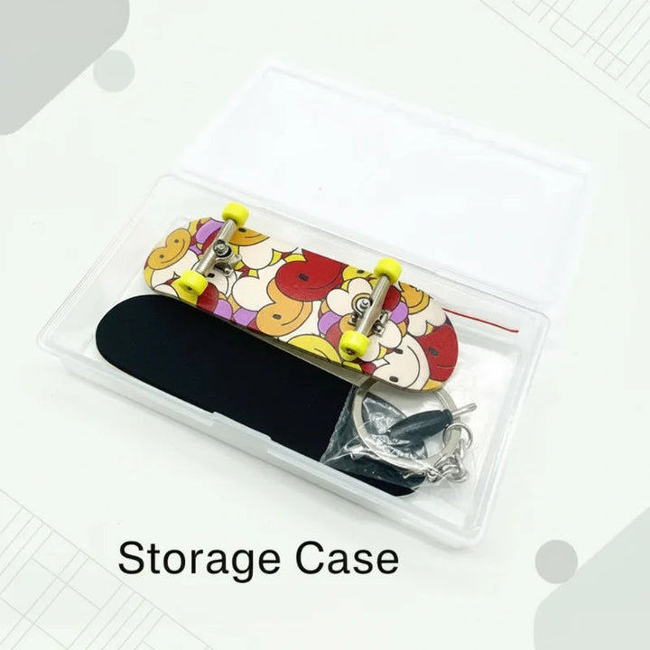 Clear storage case holding a graphic finger skateboard, black grip pad, and assembly accessories.