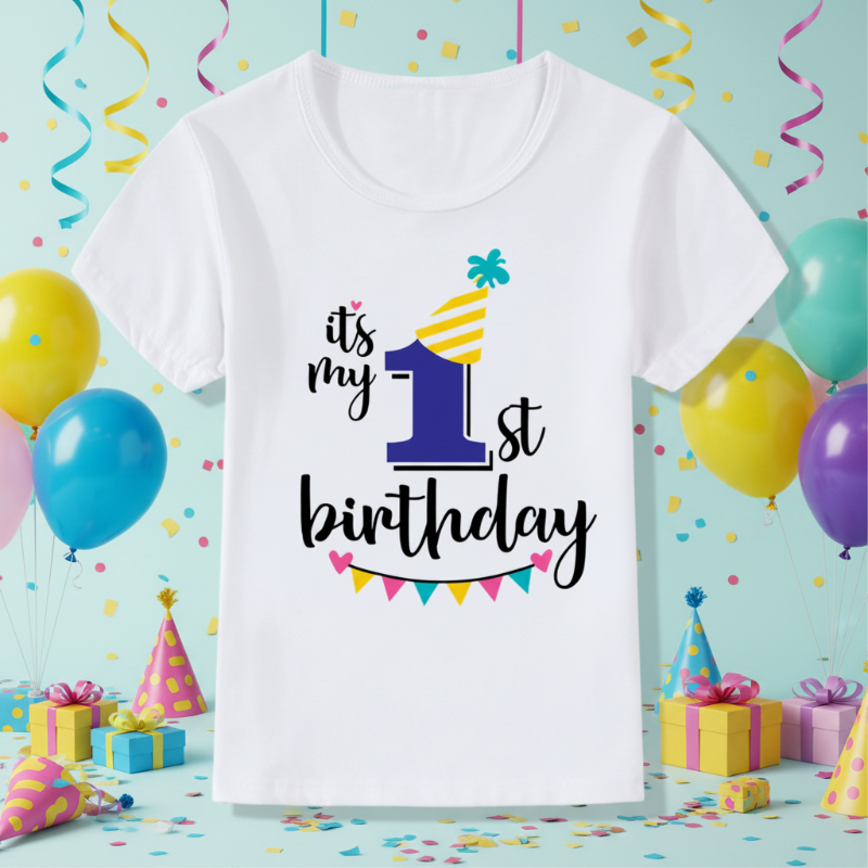 White first-birthday T-shirt with a blue number 1, yellow party hat, and colorful bunting