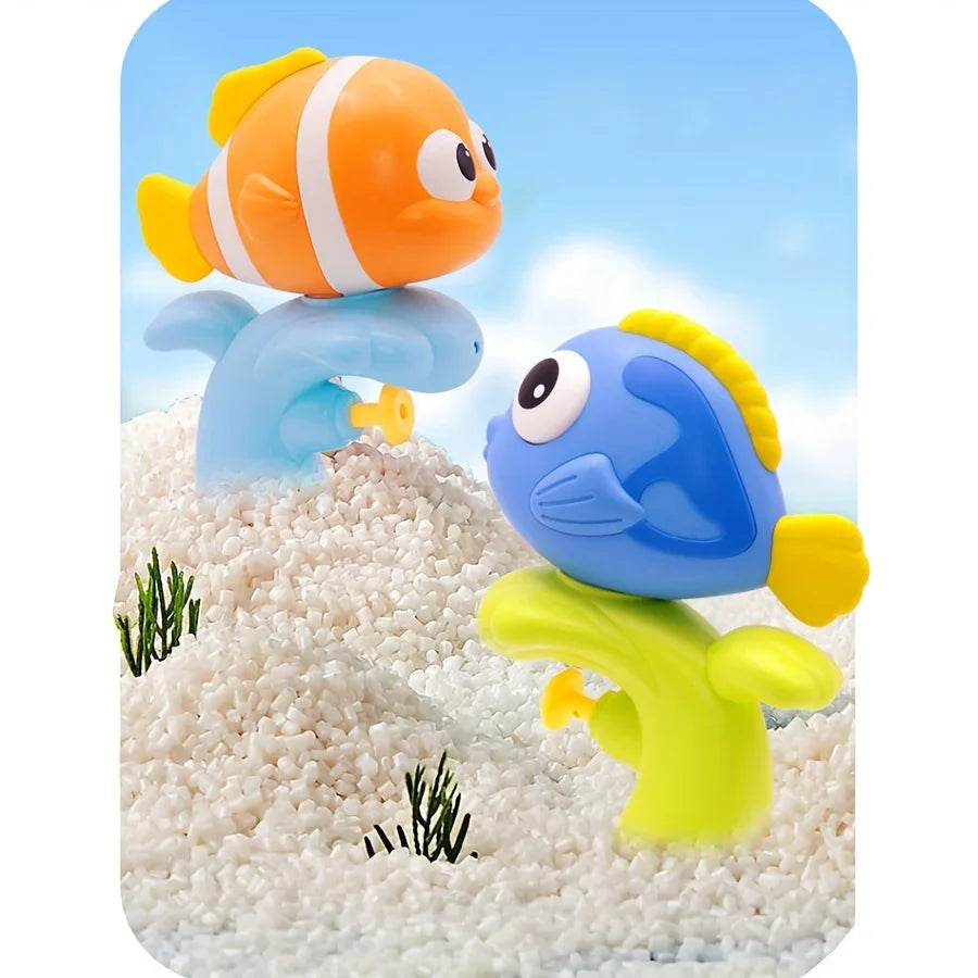 Orange and blue fish bath squirters standing on their curved handles