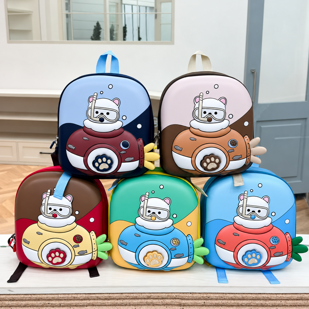 Five colorful kids' backpacks with animal diver designs, submarine details, and paw accents