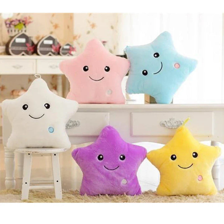 Smiling star plush pillows in white, pink, blue, purple and yellow