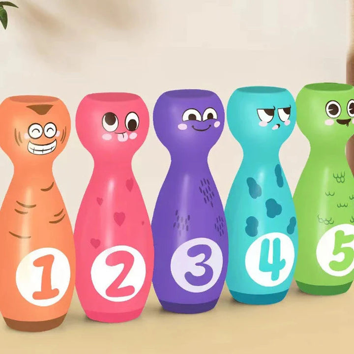 Five bowling pin designs with numbers 1 through 5 and different cartoon faces